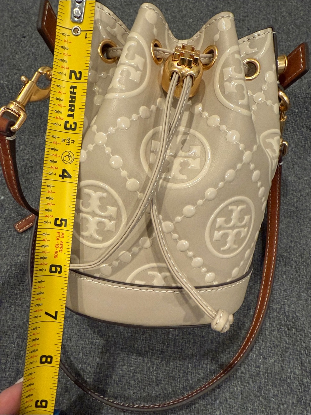 Tory Burch Beige Embossed Monogram Mini Bucket Bag - Picture 11 of 11